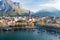 Sunny aerial cityscape of Lecco town on spring morning. Picturesque waterfront of Lecco town located between famous Lake Como and