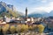 Sunny aerial cityscape of Lecco town on spring morning. Picturesque waterfront of Lecco town located between famous Lake Como and