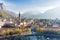 Sunny aerial cityscape of Lecco town on spring morning. Picturesque waterfront of Lecco town located between famous Lake Como and