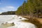 Sunny April day on the shore of Ladoga lake . Leningrad Region