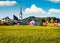 Sunny autumn scene of Pfarramt Catholic Church. Captivating morning view of the Gosau village in the district of Gmunden in Upper