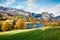 Sunny autumn view of Grundlsee lake. Fantastic morning scene of Brauhof village, Styria stare of Austria, Europe. Colorful view of