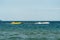 Sunny Beach, Bulgaria July 13, 2019. Inflatable recreational banana boat with people towed by a motorboat in the Black Sea on the