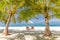 Sunny beach getaway couple destination scenic, honeymoon panoramic wallpaper. Palm tree idyllic sky sea sand