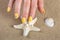 Sunny Beach Manicure: Yellow Nails, Starfish, and Shell on Sand