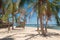 Sunny beach with palms on Luli Island, Honda bay, Palawan,  Philippines