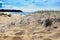 Sunny beach scene with distant people