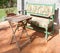 Sunny bench and table in garden courtyard