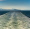 Sunny bright panorama of turbulent ship wash in the vast ocean channel of Stephen`s Passage, Alaska, USA Inside Passage.