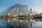 Sunny cityscape of Lecco town on spring day. Picturesque waterfront of Lecco town located between famous Lake Como and scenic