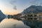 Sunny cityscape of Lecco town on spring day. Picturesque waterfront of Lecco town located between famous Lake Como and scenic