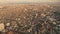 Sunny cityscape at river bank aerial. Sunset light over modern buildings at downtown streets