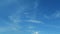 Sunny clear cyan blue sky background with wispy smoke cirrus clouds