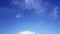 Sunny clear cyan blue sky background with wispy smoke cirrus clouds