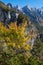 Sunny colorful autumn alpine scene. Peaceful rocky mountain view from hiking path near Almsee lake, Upper Austria