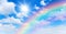 Sunny day background with rainbow, blue sky with white cumulus clouds and sun