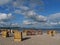 Sunny day on the beach of Eckernfoerde with hooded beach chairs on the sand, Germany