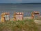 Sunny day on the beach of Eckernfoerde with hooded beach chairs on the sand, Germany