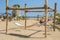 Sunny day on the beach, Suspended swing on a construction, leisure concept, vacation mode, people on the beach