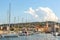 Sunny day in harbor. View of yachts moored in a small coastal town Muggia