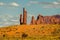 Sunny Day in Monument Valley, Utah. The Totem Pole and Cloudy Blue Sky