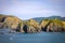 Sunny day with Nature background. Small island in New Zealand. Hills and mountains in summer.