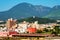 A sunny day in a resort town of Beppu, Japan, with a view of mountains embracing the city