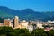 A sunny day in a resort town of Beppu, Japan, with a view of mountains embracing the city