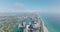 Sunny day on sea coast. luxury apartment houses in urban neighbourhood, aerial panoramic footage. Miami, USA