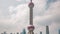 Sunny day shanghai oriental pearl tower down to top view 4k time lapse china