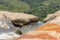 Sunny day in the Tropical waterfall falls from the mountain cliff to the jungle, serene landscape of Diyaluma falls.