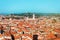 Sunny day in Verona, Italy. View from above on old town red roofs, square, streets and landmarks.