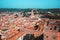 Sunny day in Verona, Italy. View from above on old town red roofs, square, streets and landmarks.