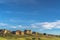 Sunny day view of multi storey houses with golf course in the foreground