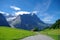 Sunny day view to the mountains vally and Mittelhorn and Mattenberg summit from road to First Grindelwald  Jungfrau region,