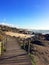 Sunny day with wood boardwalk and the Atlantic ocean in San Paio