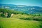 Sunny fields on hills in Tuscany, Italy