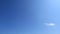 Sunny gradient blue sky background with minimal white clouds