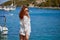 Sunny holidays on the Adriatic Sea. Woman, beach, water, yacht