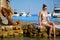 Sunny holidays on the Adriatic Sea. Woman, beach, water, yacht