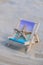 Sunny holidays on the beach with sand beach accessories with sea shells and sea star. Sun lounger stand sea Ocean