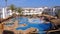 Sunny Hotel Resort with Luxury Blue Swimming Pool, Beach Umbrellas and Sunbeds in Egypt