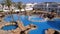 Sunny Hotel Resort with Luxury Blue Swimming Pool, Beach Umbrellas and Sunbeds in Egypt