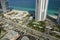 Sunny Isles Beach city with heavy urban traffic and expensive highrise hotels and condo buildings on Atlantic ocean