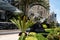 Sunny Isles, Florida, USA - May, 2020: Trump International Beach Resort. Globe sign and palm tree. Trumps business.