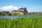 Sunny June day on the Vanajavesi lake. View of the old fortress of Hameenlinna, Finland