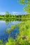 Sunny landscape Narew river blue sky green trees