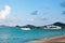 Sunny Maenam beach of Koh Samui, pier with boats Thailand