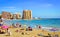 Sunny Mediterranean beach, Tourists relax on sand