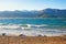 Sunny Mediterranean landscape on  windy day. Sea, waves and deserted pebble beach. Montenegro, Bay of Kotor